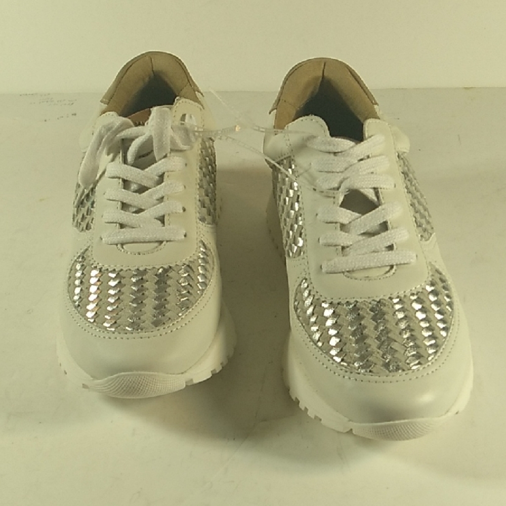 New, White And Silver Size 7m Woman Sneakers with Silver Accents.